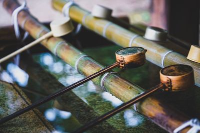 Close-up of spoons on bamboos