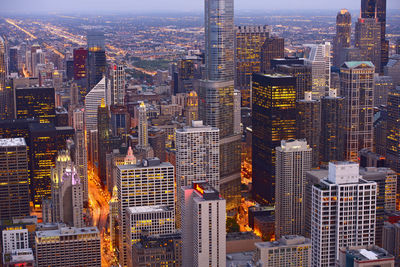 High angle view of illuminated buildings in city