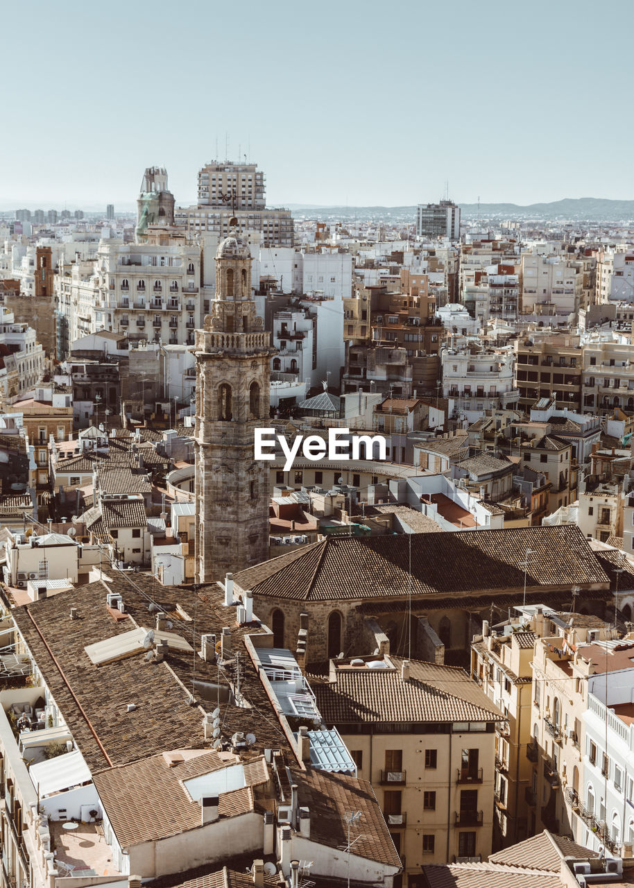 High angle view of buildings in city against clear sky