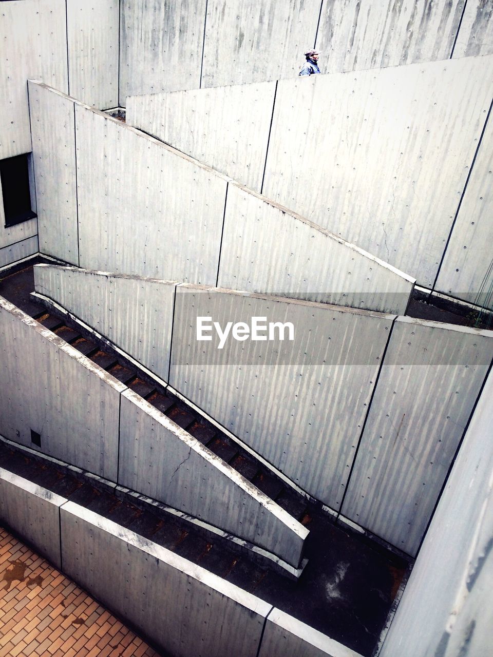 Side view of man walking on stairs
