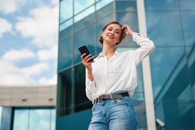 Mid adult woman using mobile phone