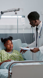 Doctor examining patient in hospital